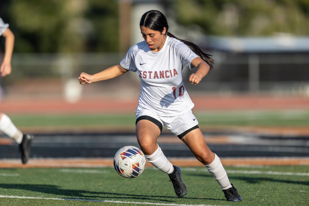 Estancia's Paloma Vallejo (10) dribbles with the ball at her feet against San Jacinto in a CIF Division 5 semifinal.
