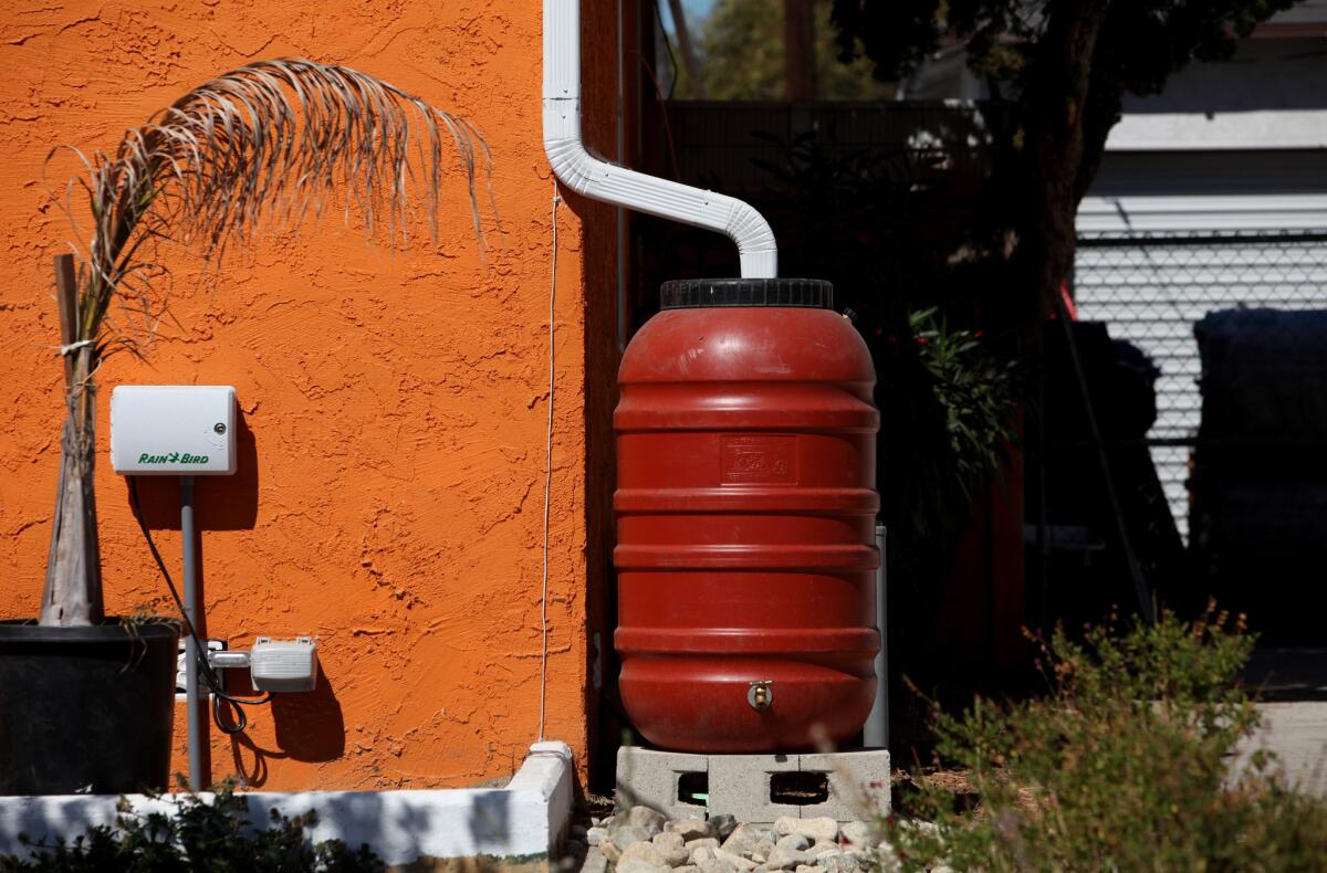 A rain barrell sits on the side of a home on a block on Elmer Avenue in Sun Valley.