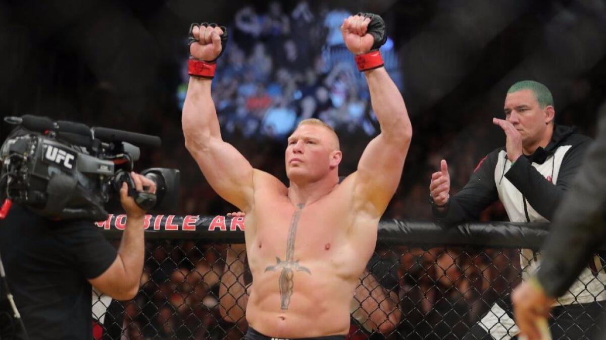 Brock Lesnar raises his arms before his UFC 200 fight with Mark Hunt on July 9.