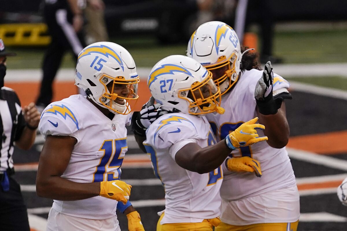 Chargers running back Joshua Kelley celebrates with teammates after scoring a touchdown against the Bengals.