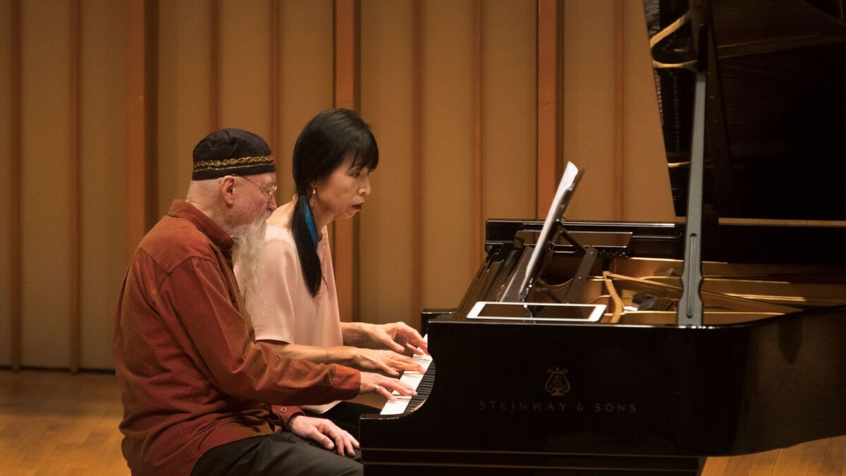 Terry Riley and Gloria Cheng at the Piano Spheres concert Tuesday at the Zipper Concert Hall at the Colburn School in Los Angeles.
