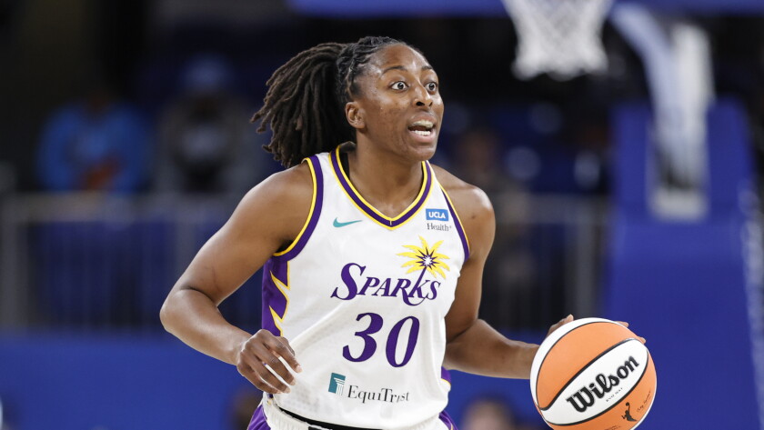 Los Angeles Sparks forward Nneka Ogwumike brings the ball up court against the Chicago Sky