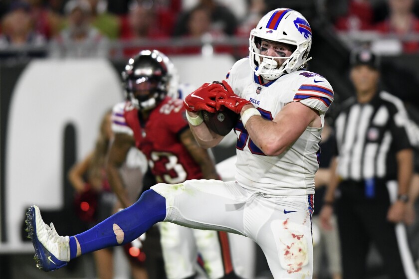 Buffalo Bills tight end Dawson Knox (88) catches a 15-yard touchdown pass from quarterback Josh Allen during the second half of an NFL football game against the Tampa Bay Buccaneers Sunday, Dec. 12, 2021, in Tampa, Fla. (AP Photo/Jason Behnken)