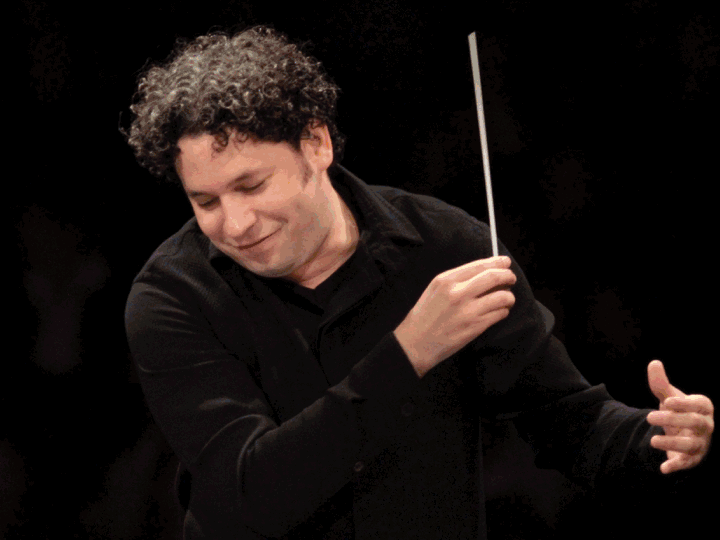 A slideshow features conductor Gustavo Dudamel, a quartet of rappers and a pair of ballet dancers.