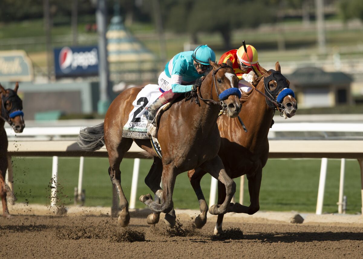 Newgate and jockey Lanfranco Dettori, outside, hold off Hard to Figure and Ramon Vazquez to win.