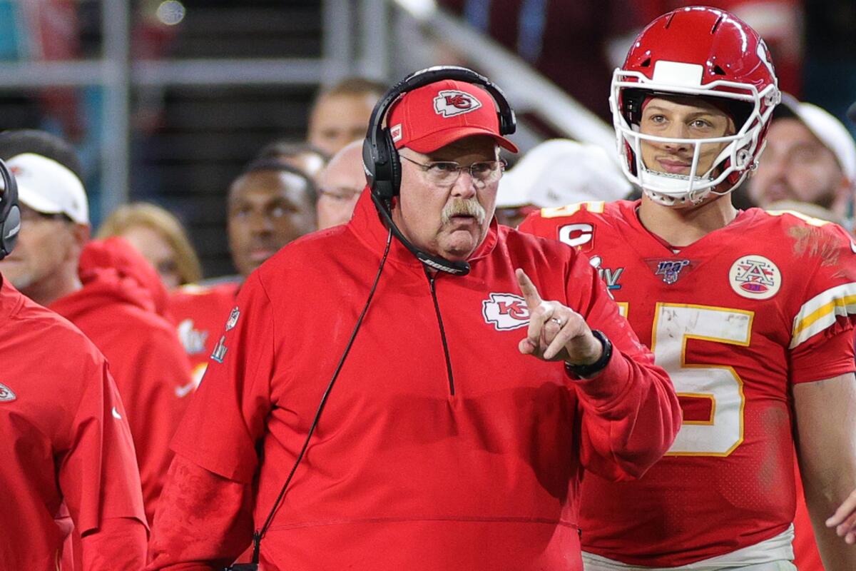 Chiefs coach Andy Reid and quarterback Patrick Mahomes (15) on the sideline.