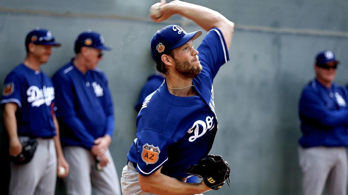 Dodgers pitcher Clayton Kershaw throws Tuesday at spring training in Arizona.