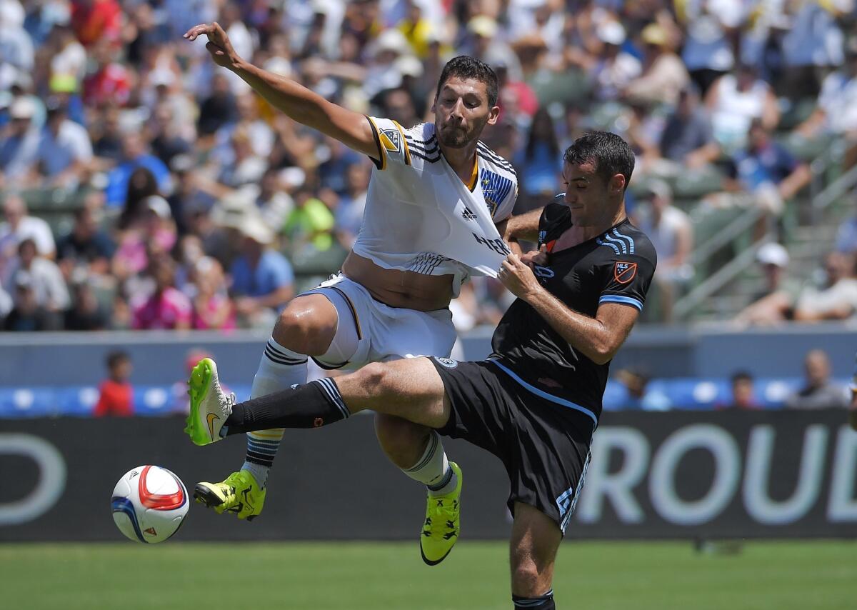 Galaxy defender Omar Gonzalez, left, and New York City midfielder Andrew Jacobson battle for the ball.
