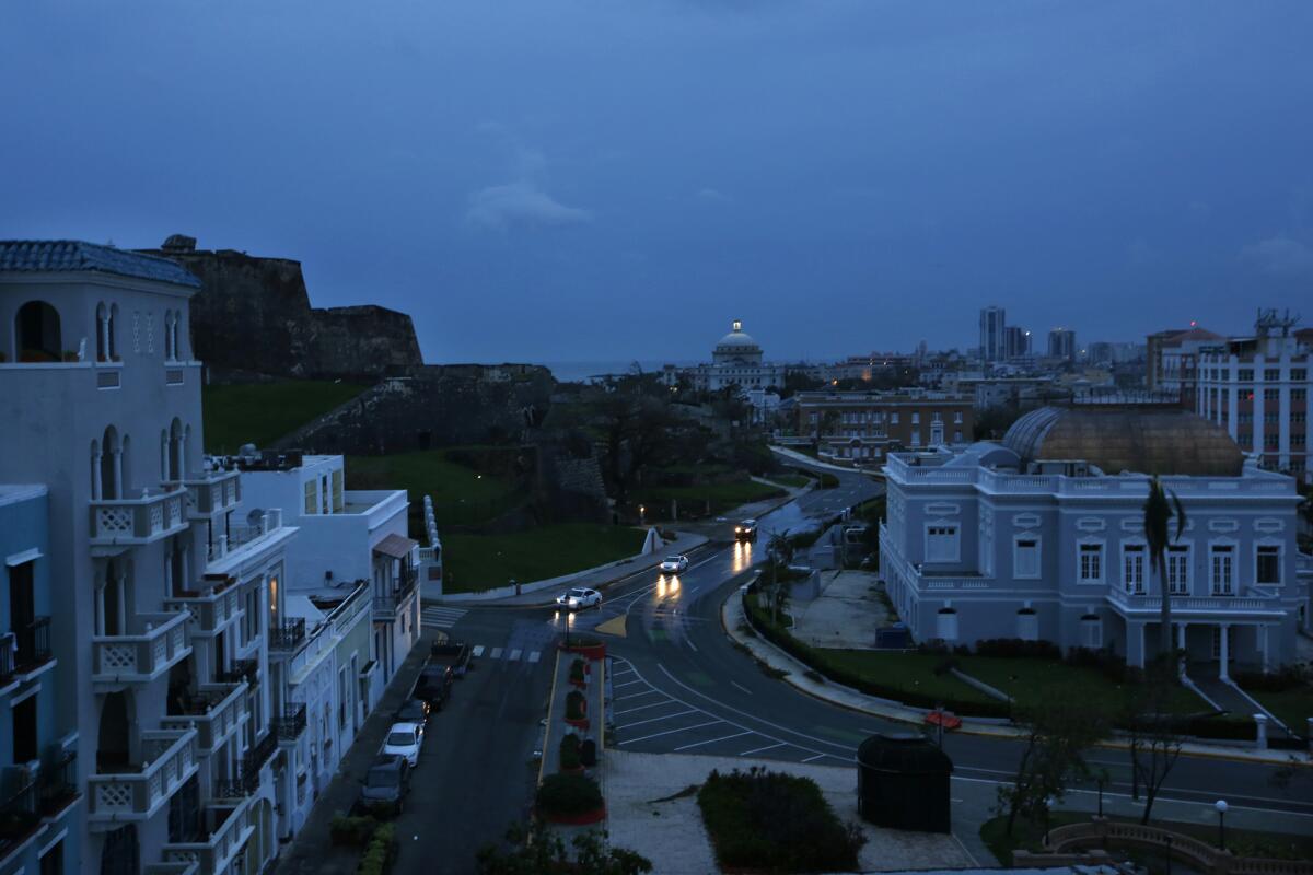 In Old San Juan, car headlights illuminate the area of La Perla.