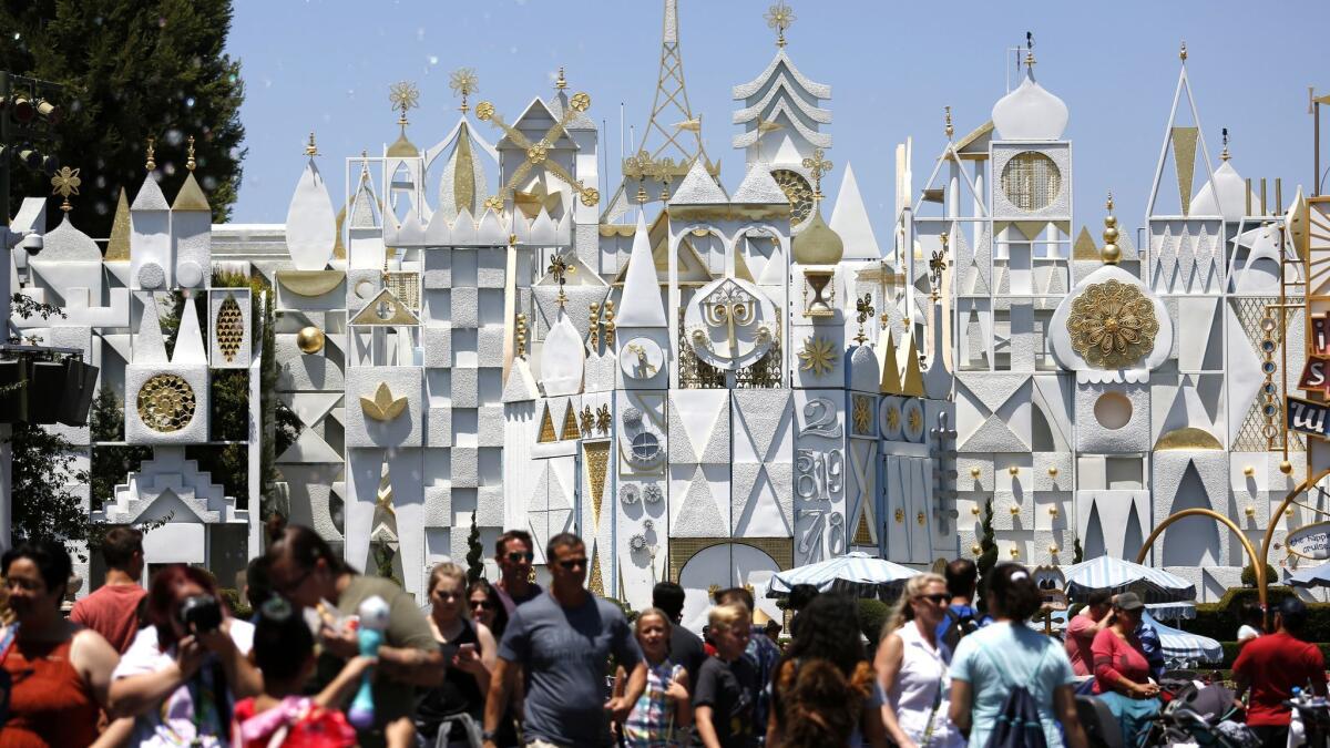 Disneyland's It's a Small World ride in 2017 with crowds in front of it