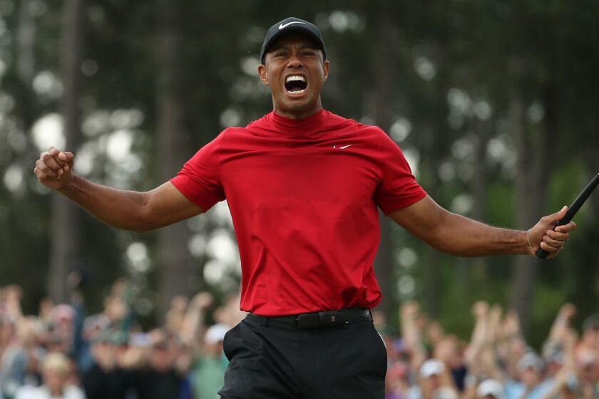 Tiger Woods celebrates after winning the Masters during the final round on Sunday, April 14, 2019, at Augusta National Golf Club in Augusta, Ga. (Jason Getz/Atlanta Journal-Constitution/TNS) ** OUTS - ELSENT, FPG, TCN - OUTS **