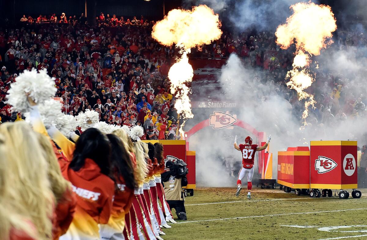 Kansas City tight end Travis Kelce makes an entrance prior to the game against Denver at Arrowhead Stadium on Dec. 25.