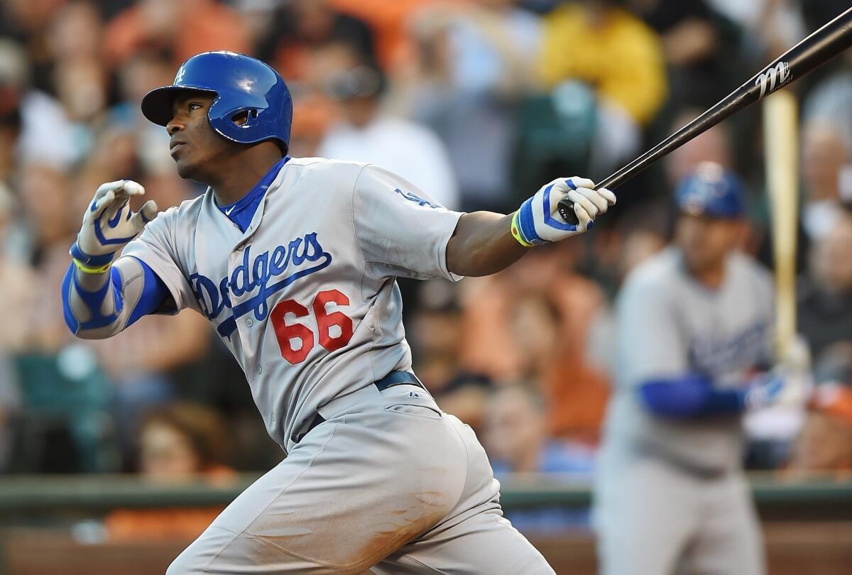 Yasiel Puig had three triples and a double while scoring twice in the Dodgers' 8-1 win Friday over the San Francisco Giants at AT&T Park.