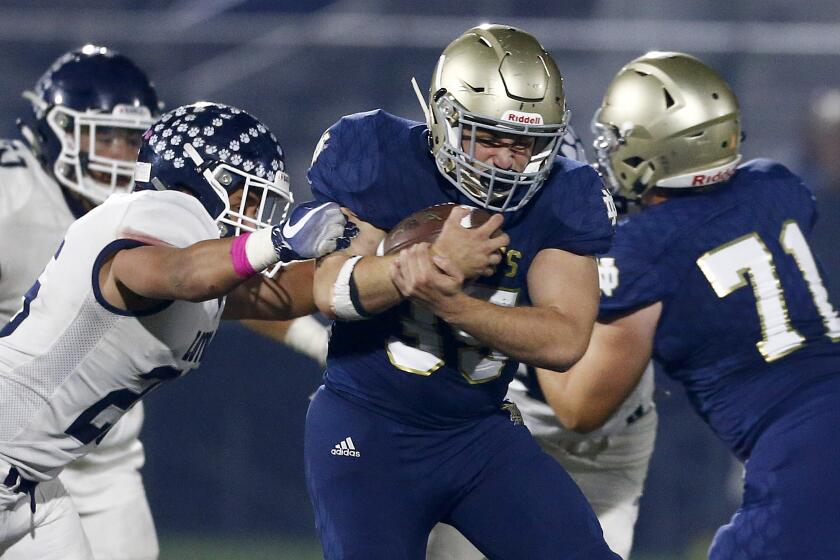 SHERMAN OAKS, CALIF. - OCT. 18, 2019. Notre Dame running back Santiago Weschler grinds out the yardage against Lyola in the third quarter in Sherman Oaks on Friday night, Oct. 18, 2019. (Luis Sinco/Los Angeles Times)