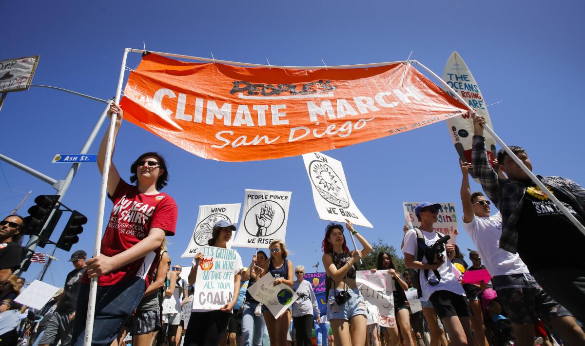 Signs of climate change at the People's Climate March, San Diego.