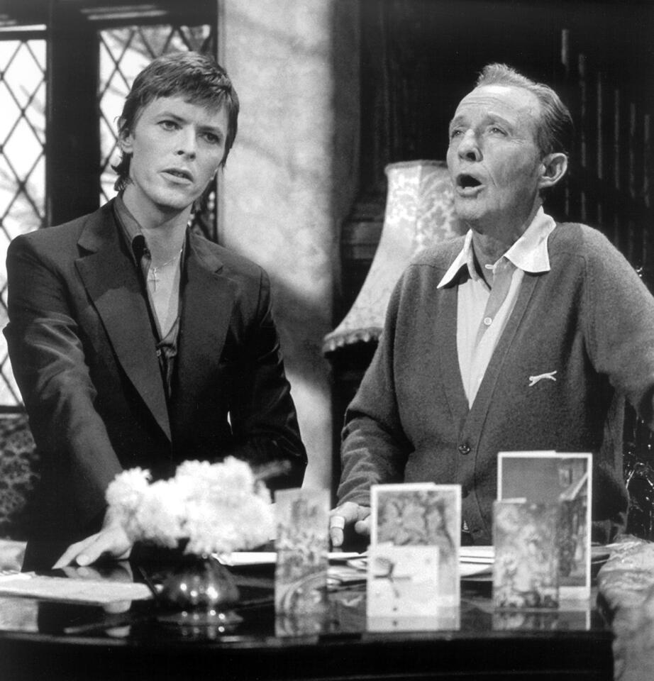David Bowie sings "The Little Drummer Boy" with Bing Crosby in a home environment.