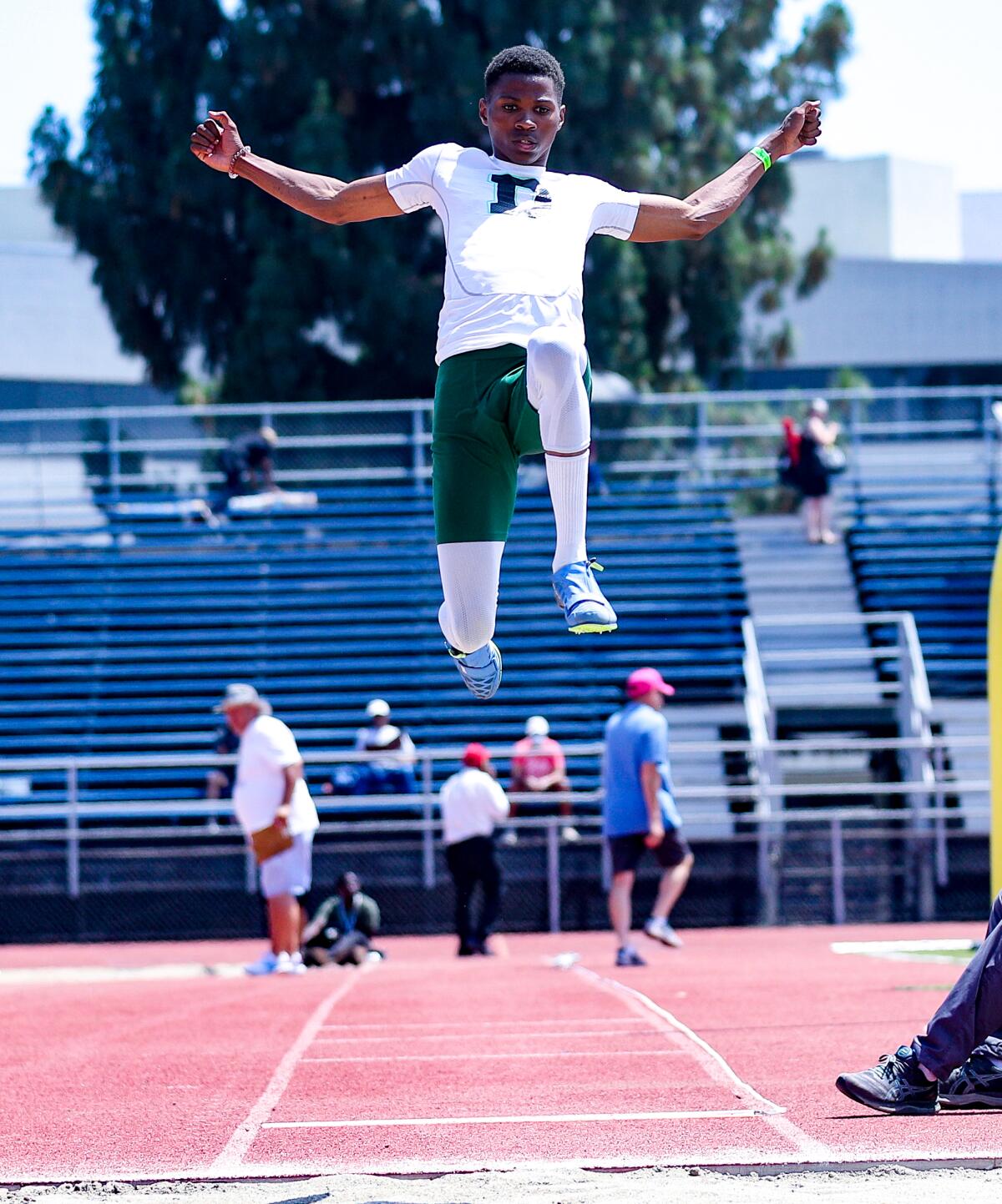 Collin Harris of Dorsey wins the long jump with a leap of 22-2 at the City Section track and field championships.