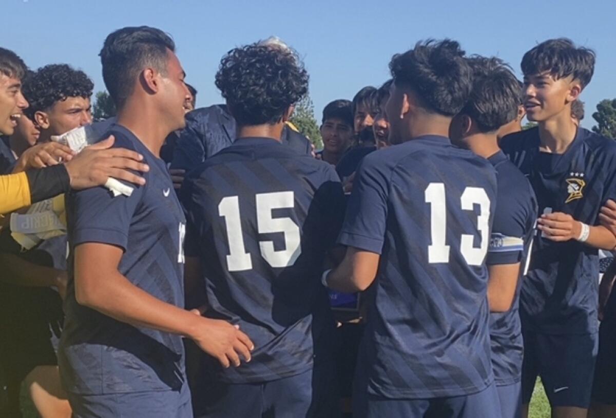 Birmingham soccer players celebrate winning the City Section Division I championship on penalty kicks.