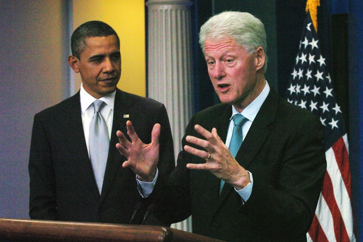 Former President Clinton speaks to reporters during a news conference with President Obama in the White House Briefing Room in Washington.