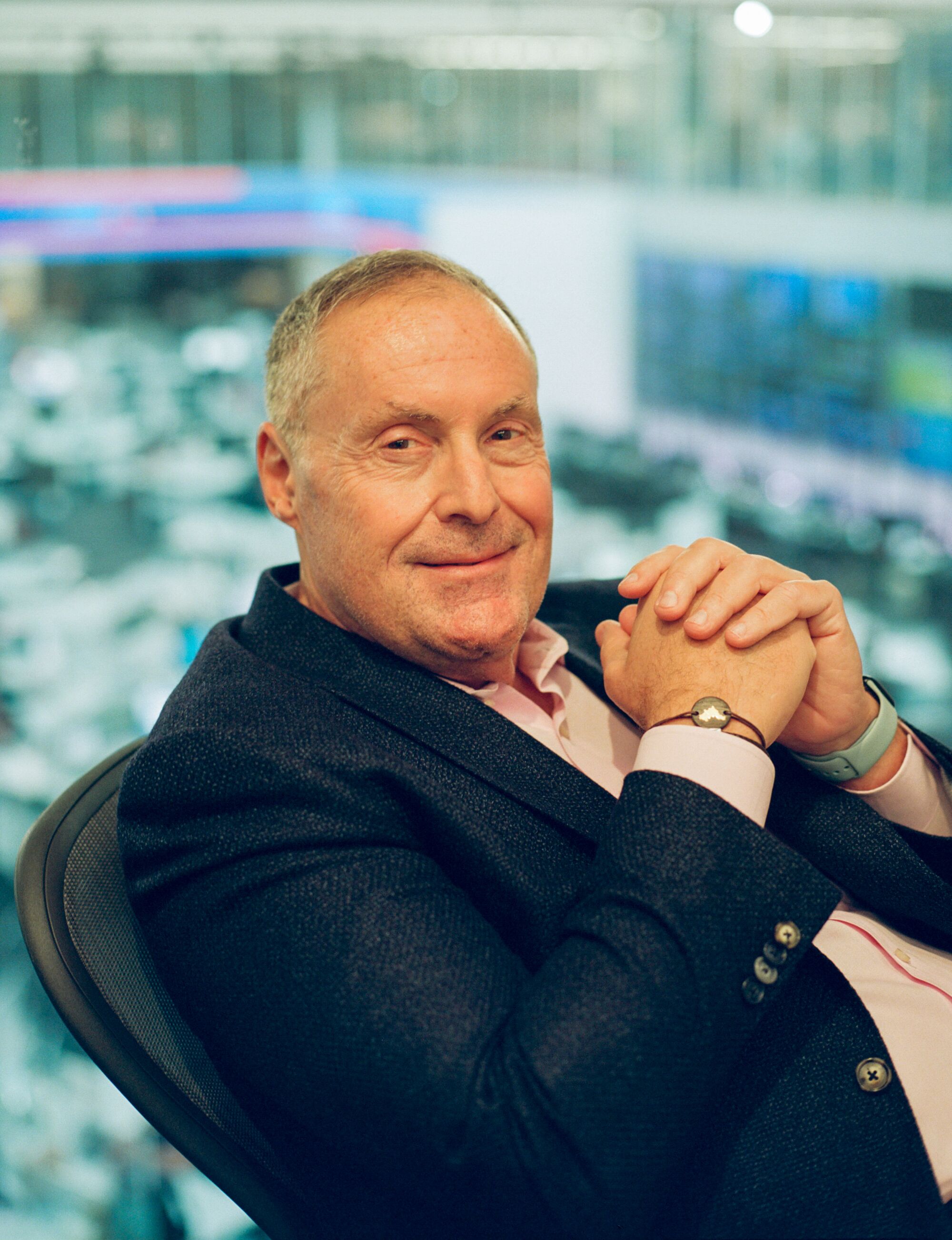 A man leans back in an office chair