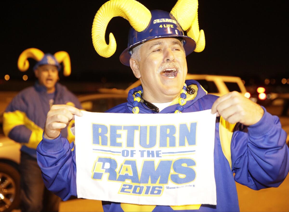 Football fans cheer for the return of the Rams to Los Angeles on the site of the old Hollywood Park horse-racing track in Inglewood on Jan. 12.