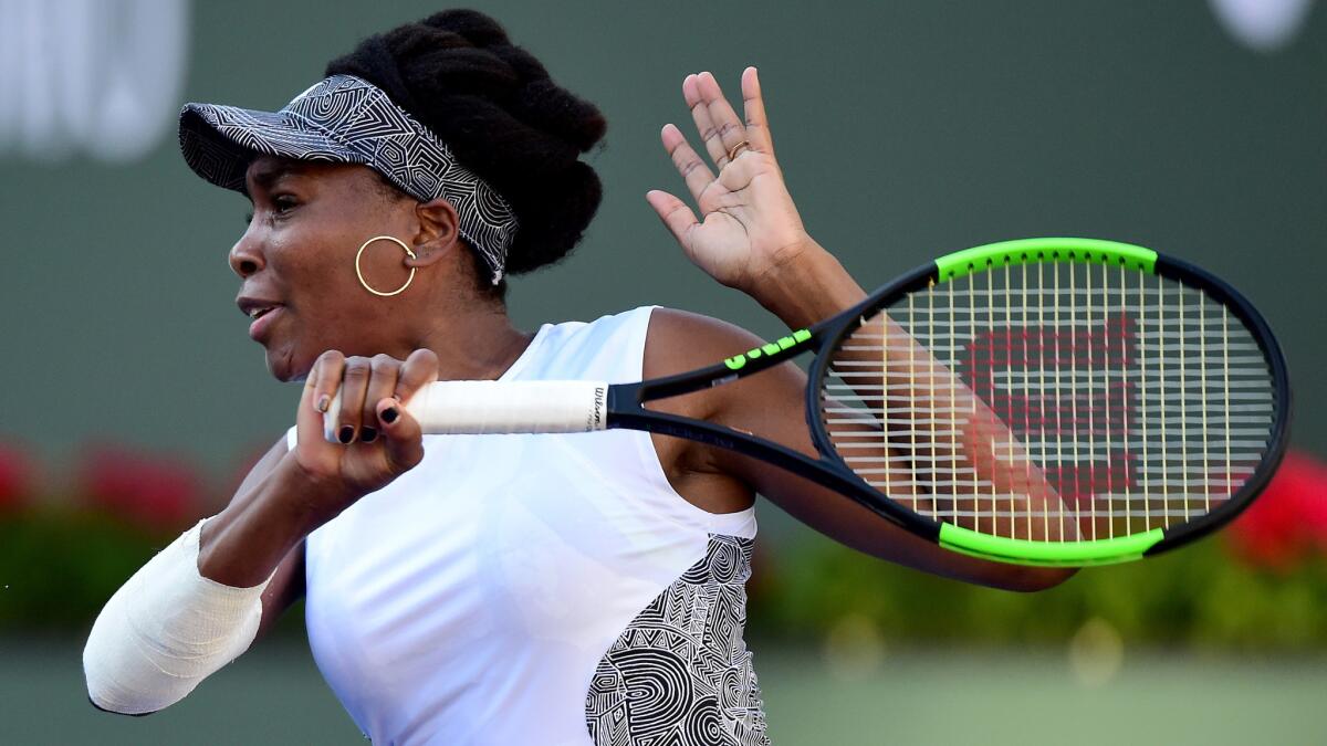 Venus Williams follows through on a forehand during her match Saturday at the BNP Paribas Open.