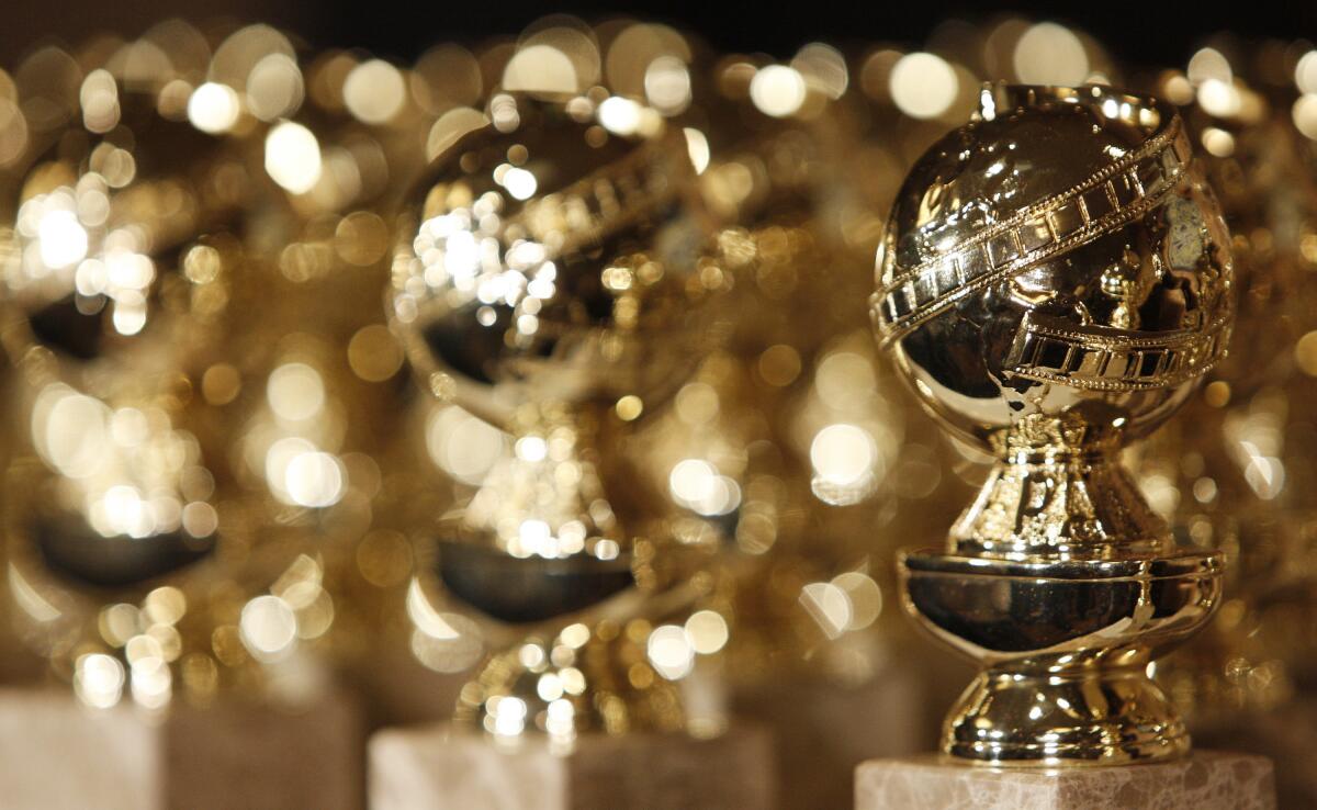 A series of Golden Globe award statuettes