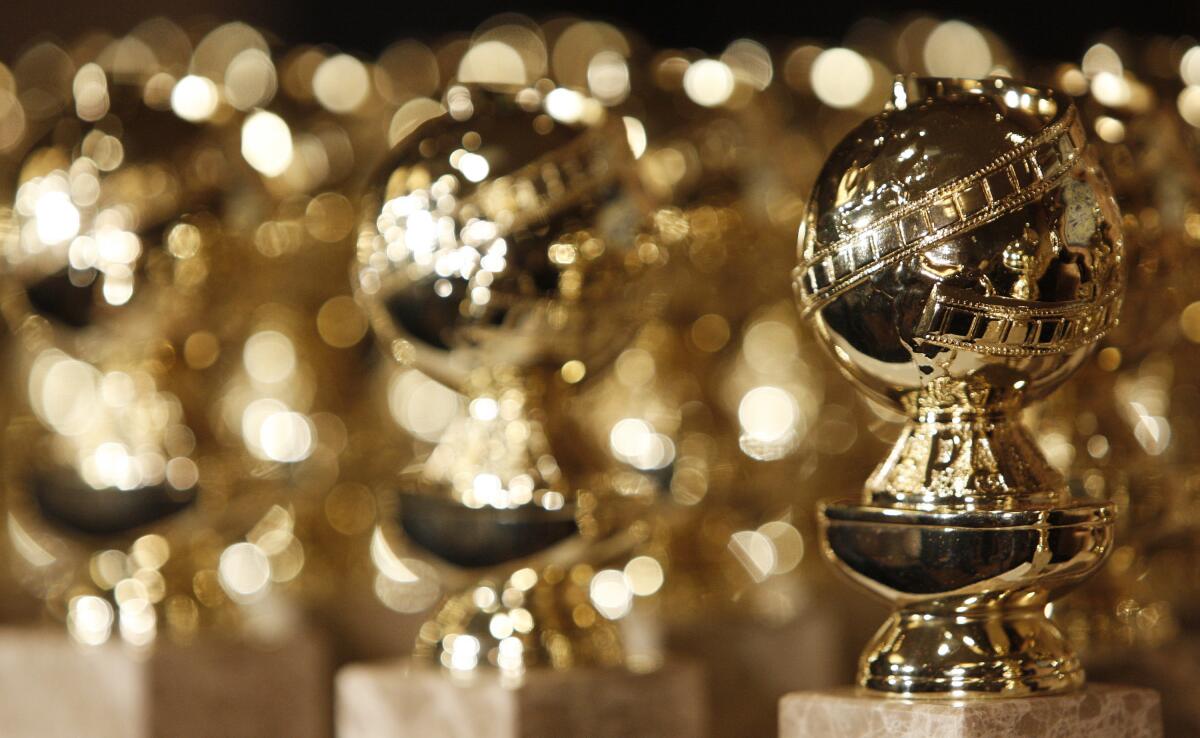 A detail showing several Golden Globe statuettes in extreme closeup