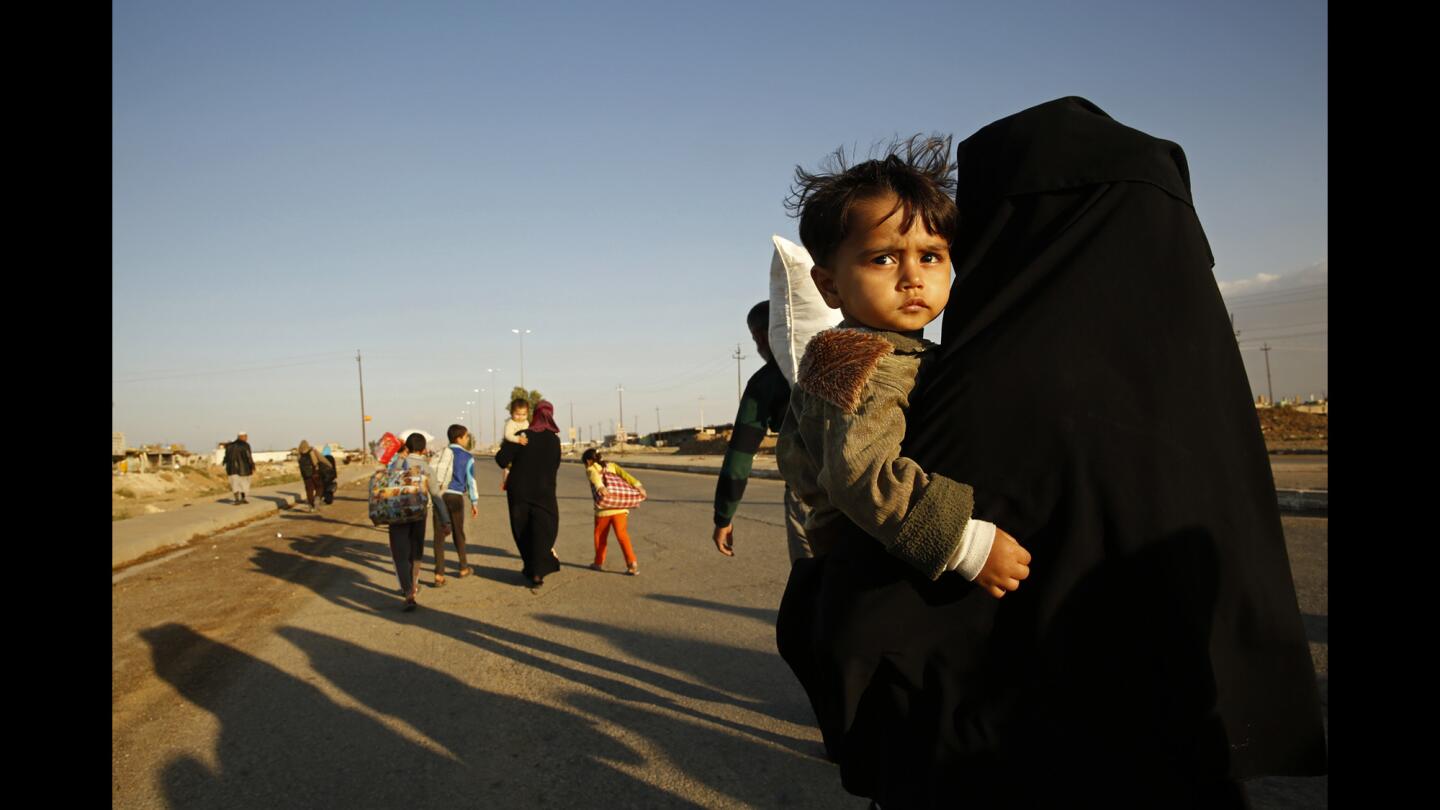 Families flee Gogjali after the area was liberated.