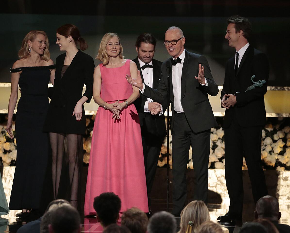 Naomi Watts, from left, Emma Stone, Amy Ryan, Zach Galifianakis, Michael Keaton and Edward Norton accept the award for cast in a motion picture for Alejandro G. Inarritu's dark comedy "Birdman." Lead actor Michael Keaton called acting "the ultimate team sport -- so collaborative."