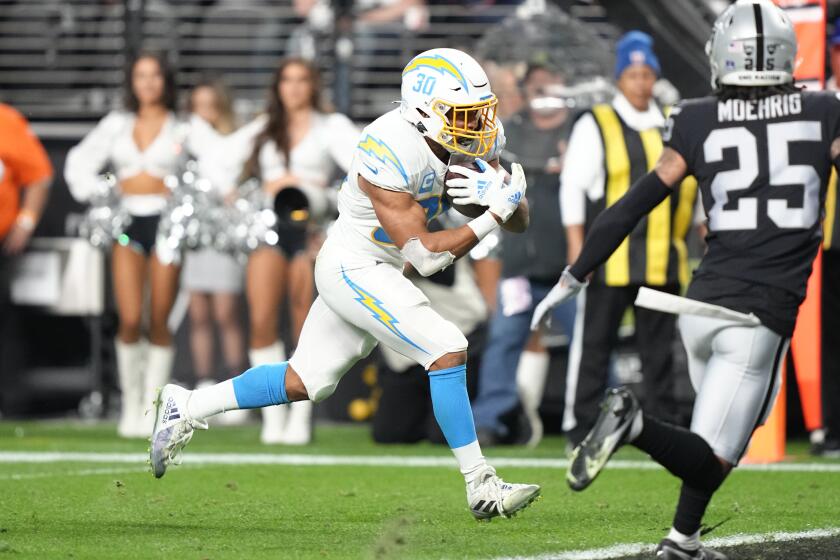 Los Angeles Chargers running back Austin Ekeler (30) runs for a touchdown.