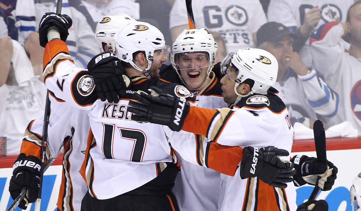 Anaheim's Ryan Kesler, left, celebrates his game-tying goal with teammates during the third period in Game Three of the Western Conference quarterfinals against the Winnipeg Jets.