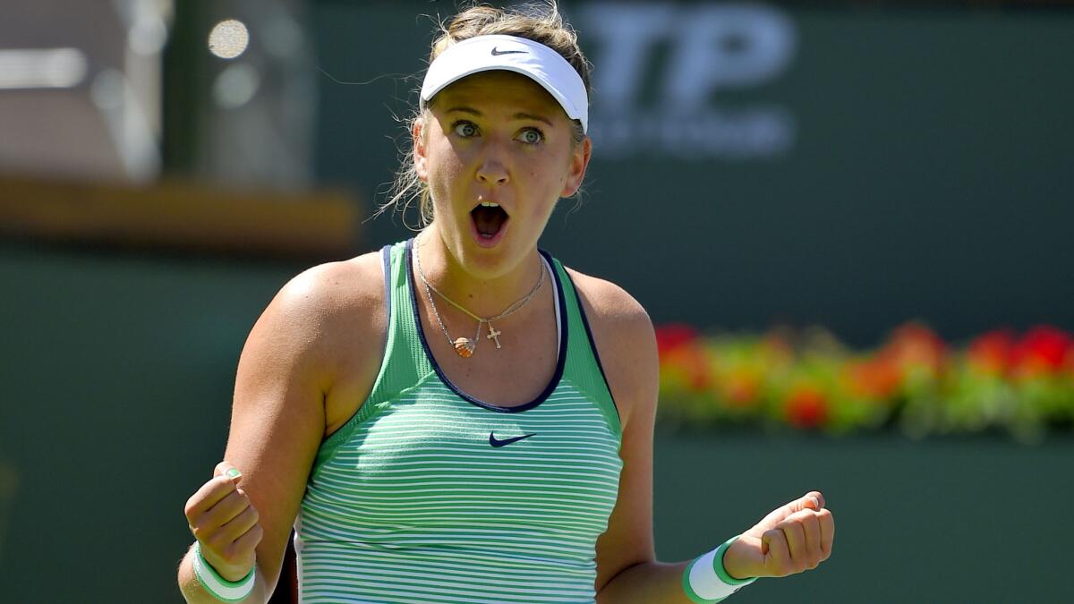 Victoria Azarenka reacts after defeating Serena Williams in a women's final at the BNP Paribas Open on Sunday in Indian Wells.