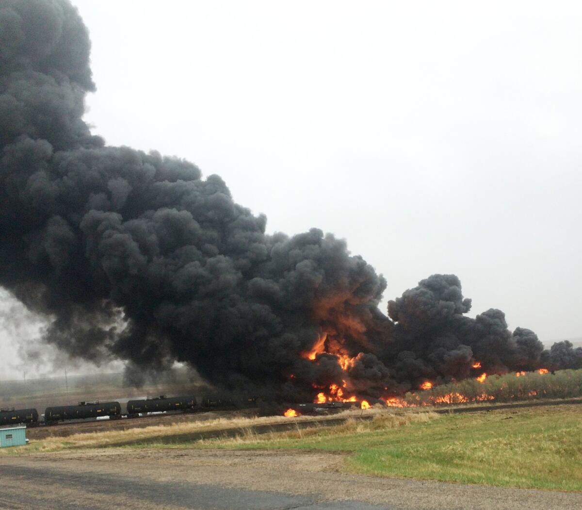 Smoke and flames rise from an oil train that derailed in North Dakota.