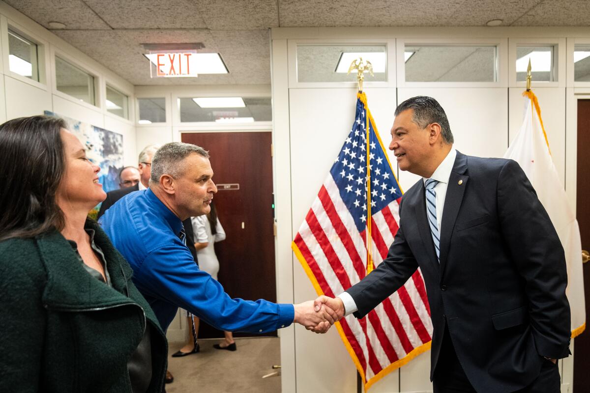 Sen. Alex Padilla, right, greets Trinity Alps Unified School District Superintendent Jamie Green in Washington, DC.
