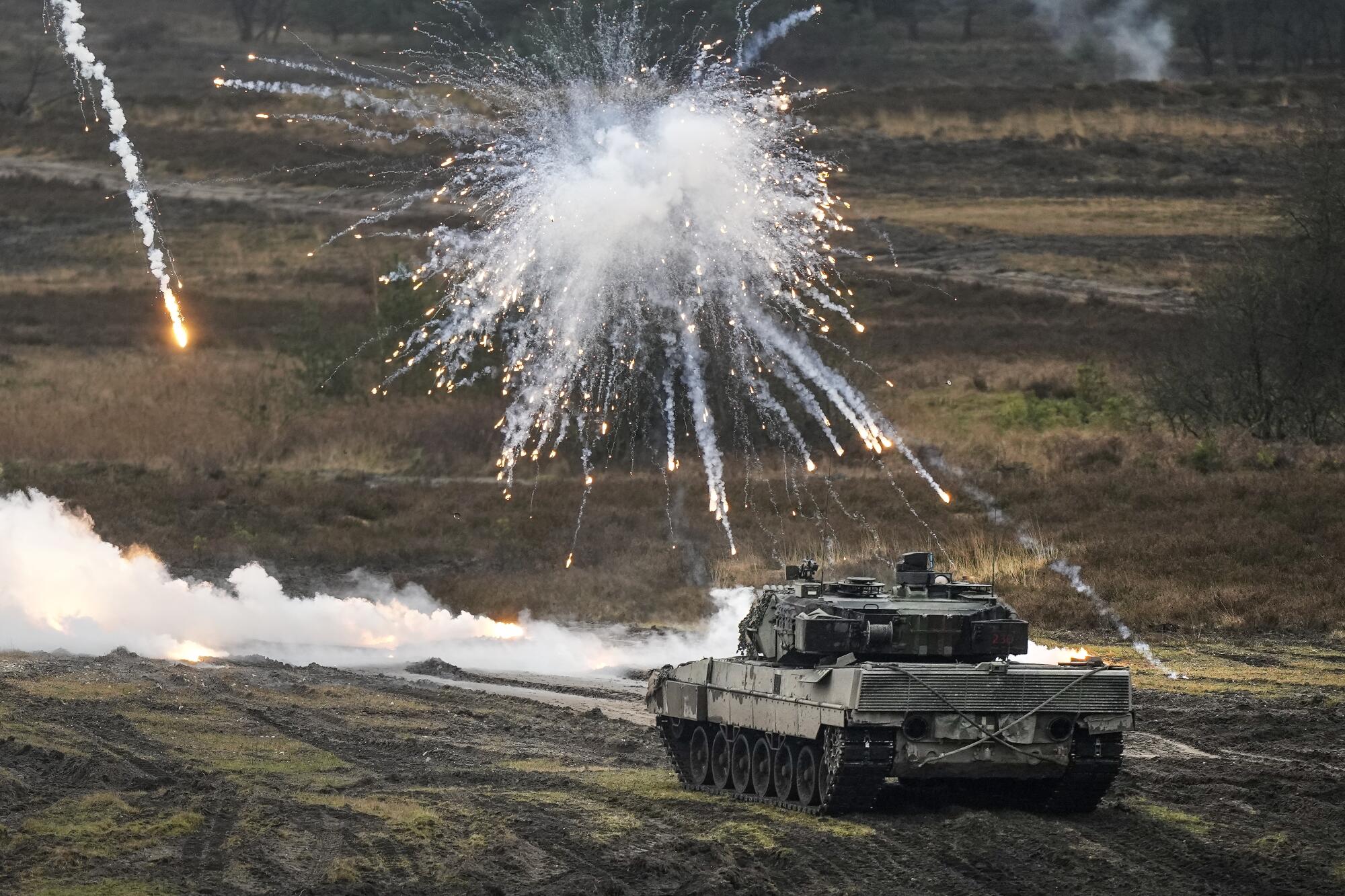 Smoke hovering over German Leopard 2 tank during military drill