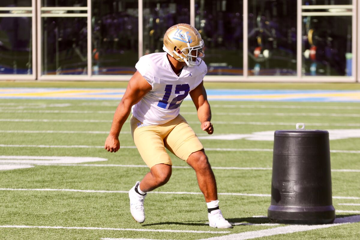 UCLA defensive end Grayson Murphy runs a drill in practice.