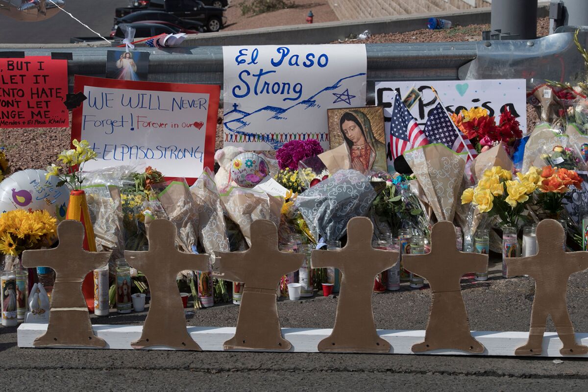 Crosses at a makeshift memorial mark the site of a shooting that left 21 people dead in El Paso.