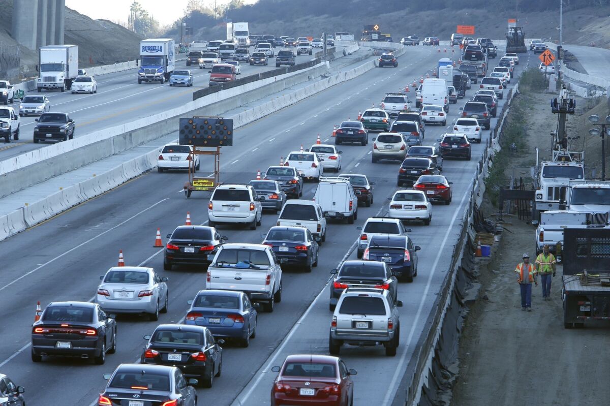 Motorists travel during morning rush hour on a section of the Sepulveda Pass. LA County voters could be asked in 2015 to fund a toll highway and rail line through the pass.