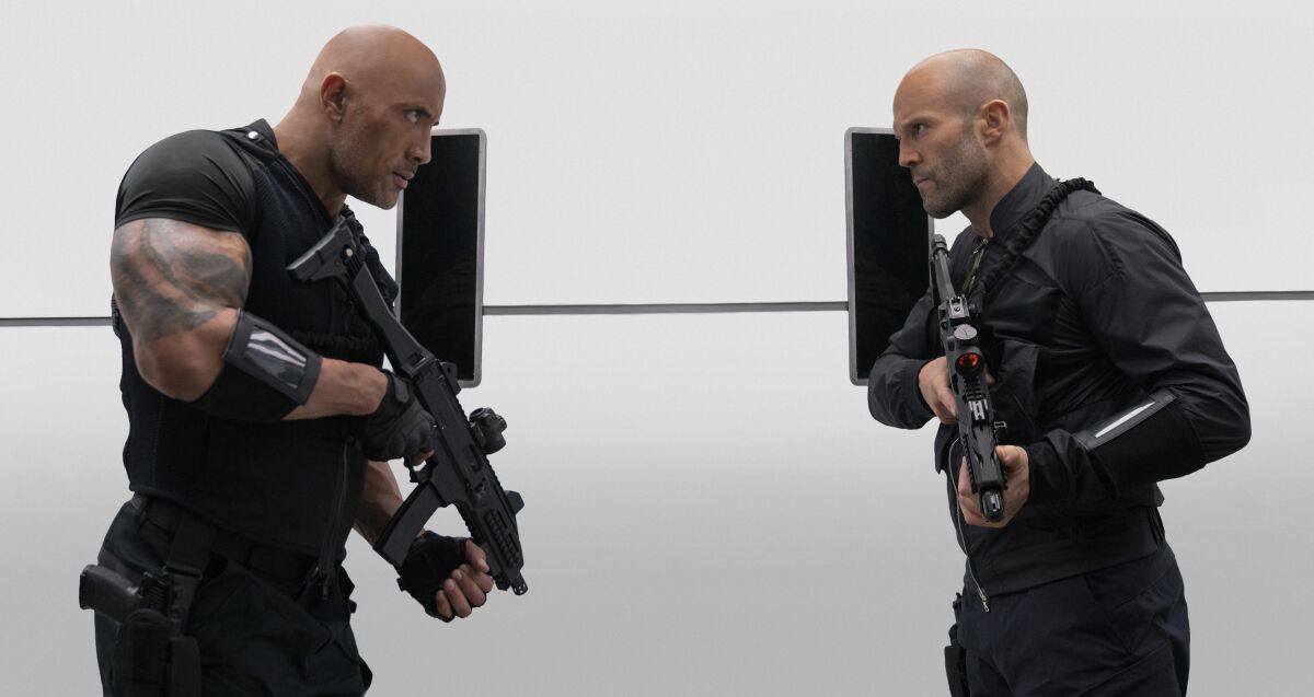 Dwayne Johnson, left, and Jason Statham in the movie "Fast & Furious Presents: Hobbs & Shaw."
