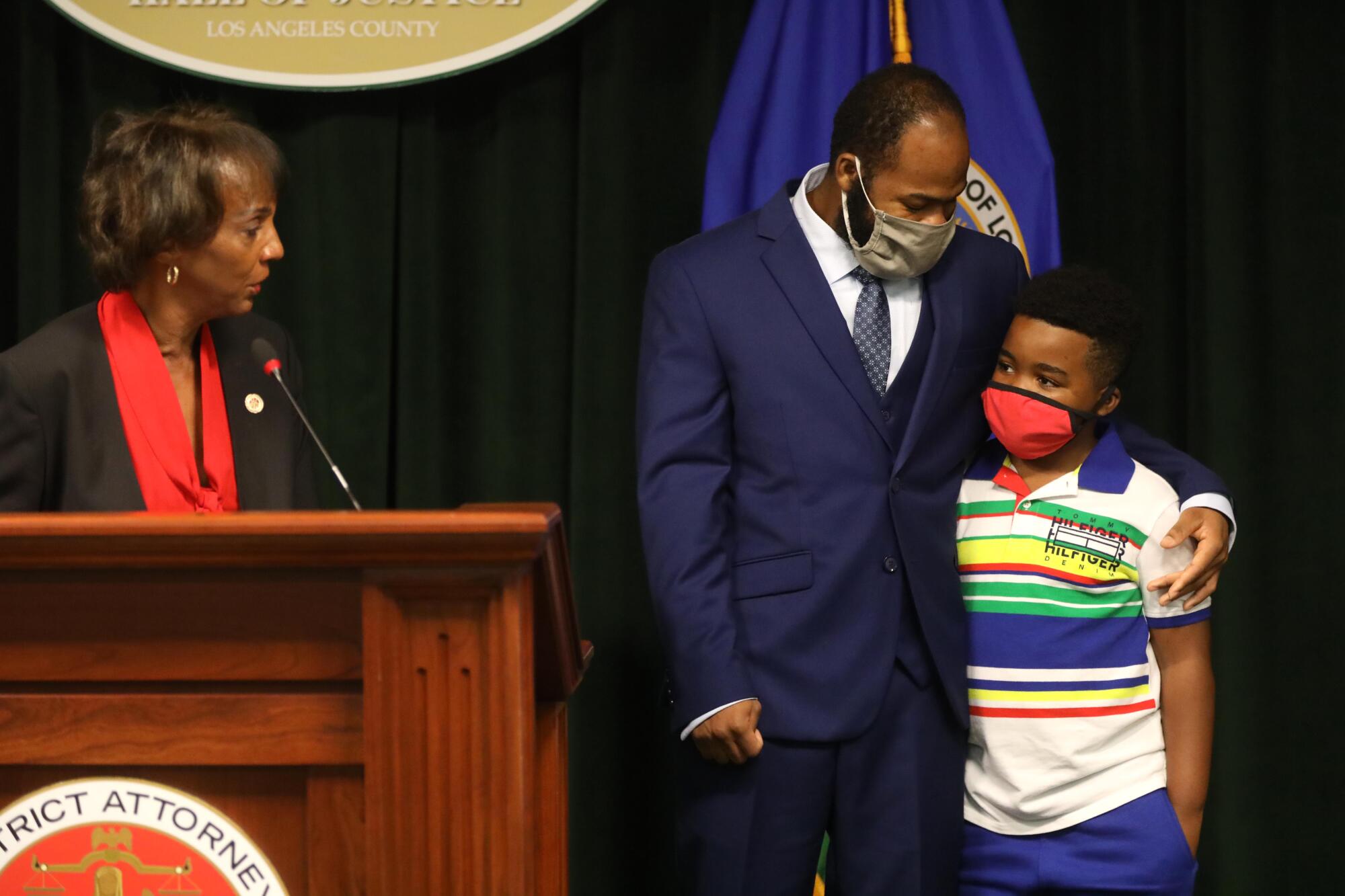 Dist. Atty. Jackie Lacey with Derrick Harris and son Derrick Jr.