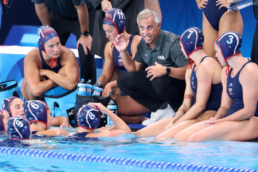 PARIS, FRANCE July 24, 2024-U.S.A. head coach Adam Krikorian speaks to his team during a timeout during a match against Greece in the 2024 Olympics in Paris, France Saturday. (Wally Skalij/Los Angeles Times)