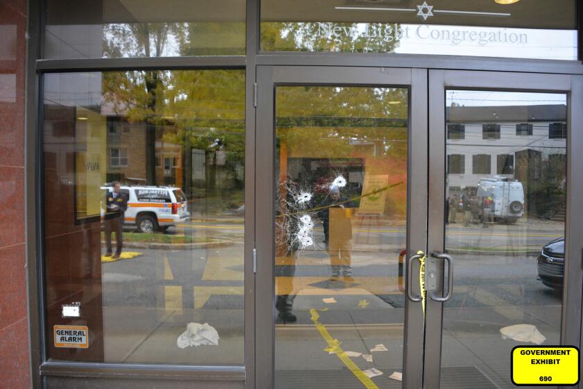 This photo of bullet damaged doors in the Tree of Life synagogue building in Pittsburgh was entered June 1, 2023, as a court exhibit by prosecutors in the federal trial of Robert Bowers. He faces multiple charges in the killing of 11 worshippers from three congregations and the wounding of seven worshippers and police officers in the building on Oct. 27, 2018. The charges include the obstruction of the free exercise of religion, resulting in death. (U.S. District Court for the Western District of Pennsylvania via AP)
