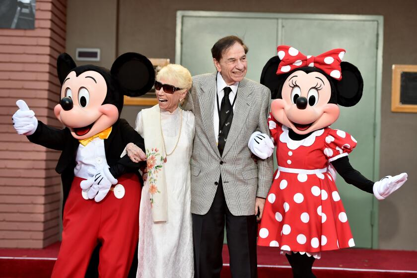 BURBANK, CA - JULY 30: (L-R) Mickey Mouse, Elizabeth Sherman, Songwriter Richard M. Sherman and Minnie Mouse attend the dedication and re-naming of the historic Orchestra Stage, now the Sherman Brothers Stage A, on the Disney Burbank lot prior to the world premiere of Disney's 'Christopher Robin' at the studio's Main Theater, on July 30, 2018. (Photo by Alberto E. Rodriguez/Getty Images for Disney)