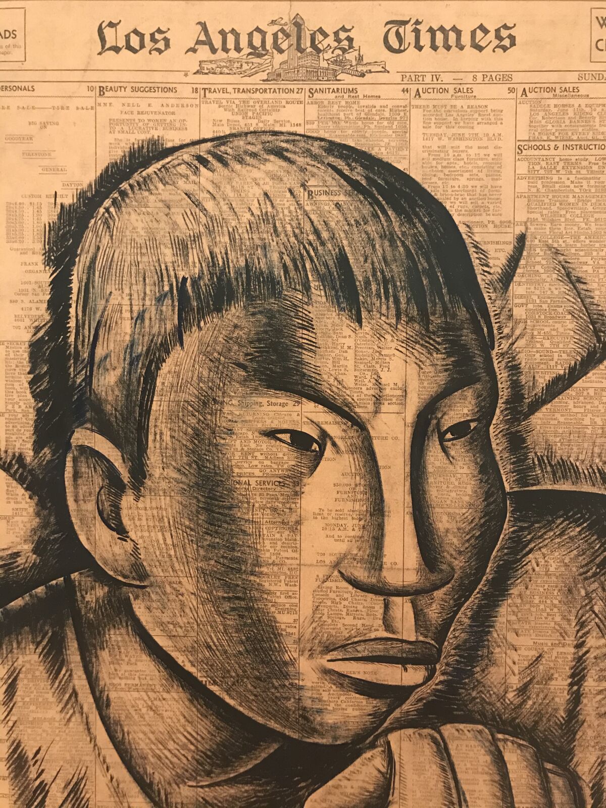 A black chalk drawing on vintage Los Angeles Times newsprint shows the face of an Indigenous man 