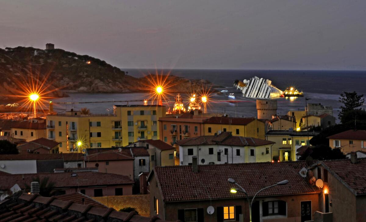 Cruise liner Costa Concordia, which ran aground in a Jan. 13 accident that killed 32, may remain in Giglio, Italy, waters for months as it is made safe to tow away.