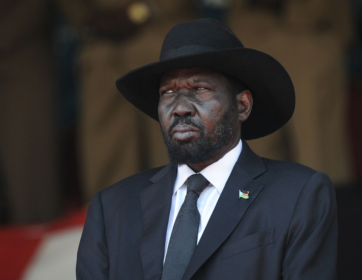 FILE - South Sudan's President Salva Kiir attends the state funeral of Kenya's former president Daniel arap Moi, at Nyayo Stadium in the capital Nairobi, Kenya, Feb. 11, 2020.An explosion of violence in South Sudan is raising fears that the country's fragile peace agreement could unravel before the transitional government wraps up early next year. (AP Photo/John Muchucha, File)