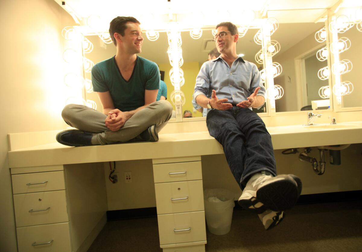 Reunited at the Taper, actor Michael Urie, left, and playwright Jonathan Tolins chat about their off-Broadway hit, now on tour.
