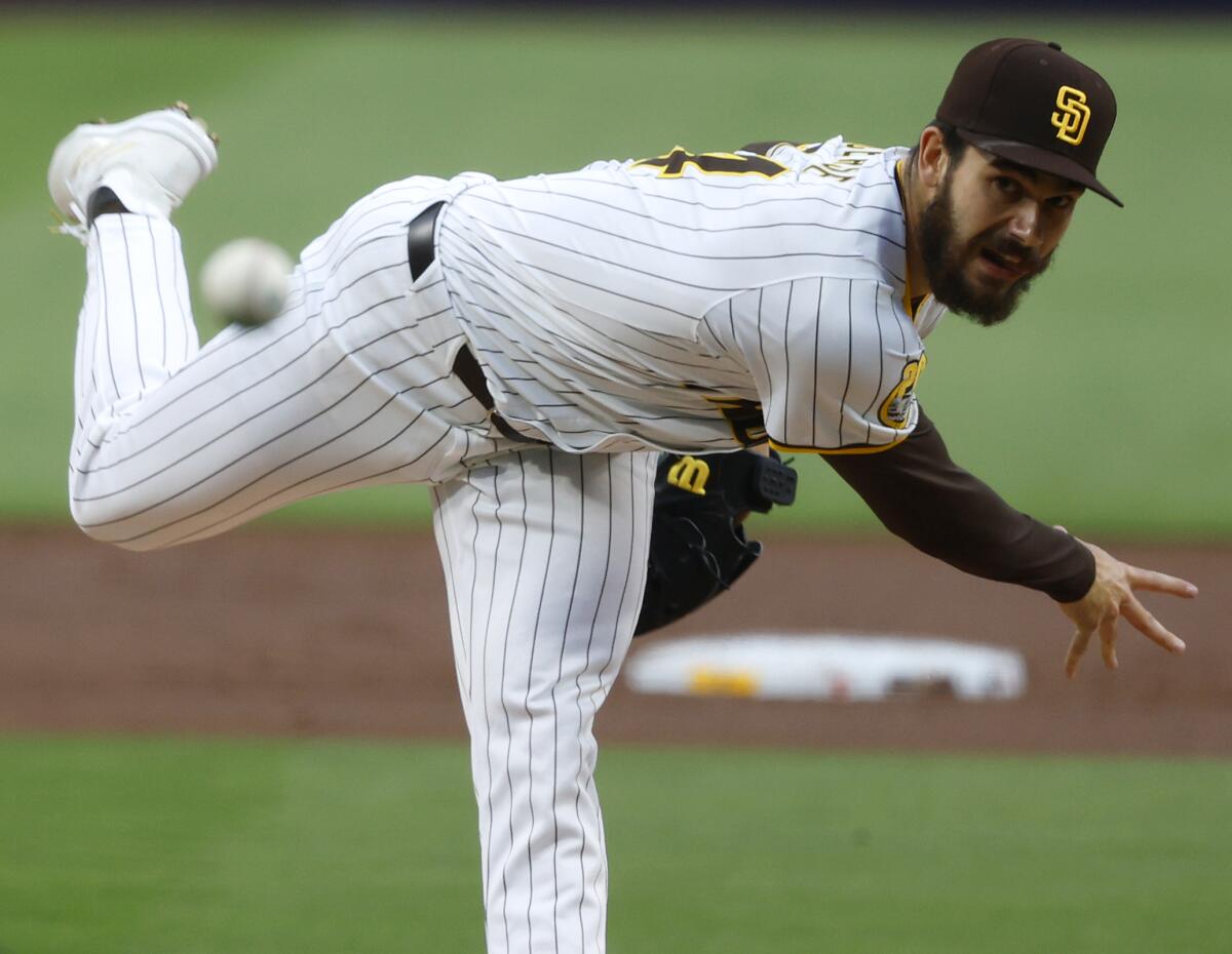 Padres starter Dylan Cease pitches against the Rockies