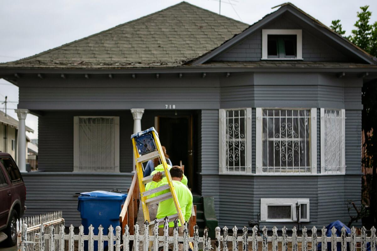Home on 27th street where clean up and repairs are underway after LAPD detonation of illegal fireworks damaged homes.